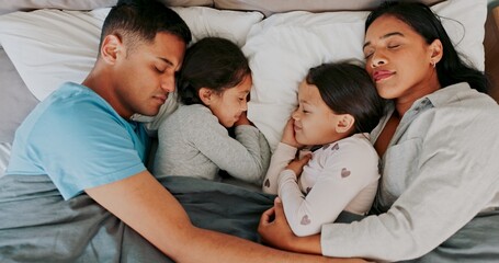 Rest, parents and children sleeping in bed for nap, dreaming or relax together in bedroom, Top view, family man and tired woman with girl kids in home for support, embrace or comfortable on weekend