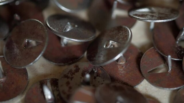 Lots of old pushpins close-up