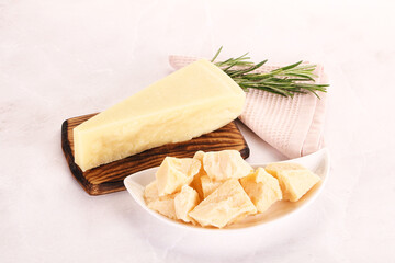 Chopped Italian hard parmesan cheese