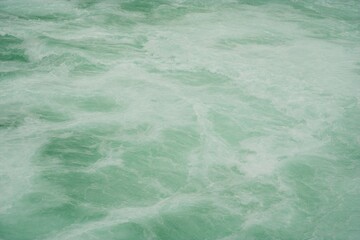 close up on the raging water in the river