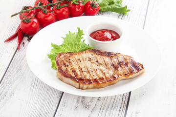 Grilled pork steak with ketchup