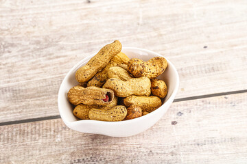 Raw ripe unpeeled peanut heap
