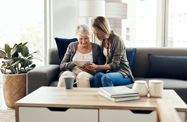 Tablet, sofa and woman with senior mom in house for help with online blog, internet or...