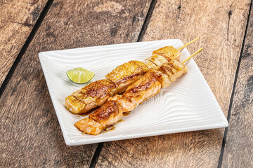 Grilled salmon skewer with sauce
