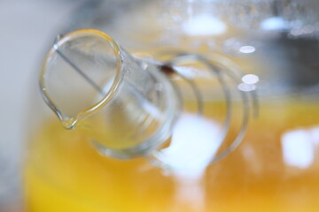 A close-up shot of a glass filled with orange juice, ready to be enjoyed.