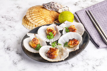 Grilled scallops shell with butter