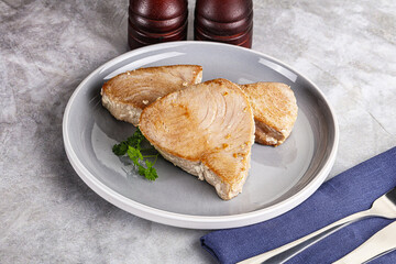 Roasted red tuna steak in the plate