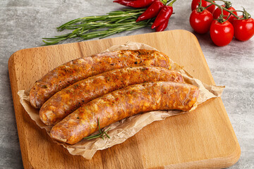 Raw sausages with spices and herbs