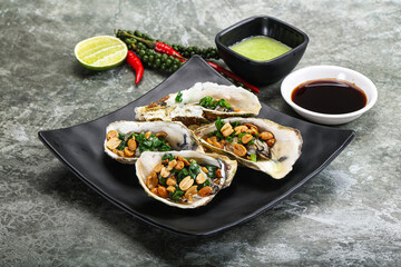 Open half oysters with green onion