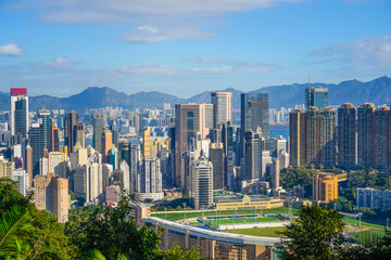 Dense urban development of tall and thin buildings view Hong Kong of the city city areas with parks and park areas