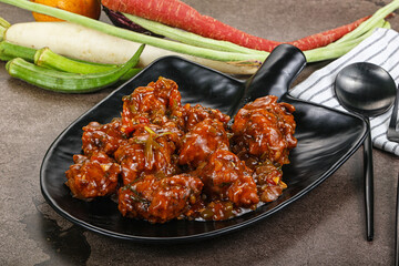 Manchurian chicken with sauce and spices