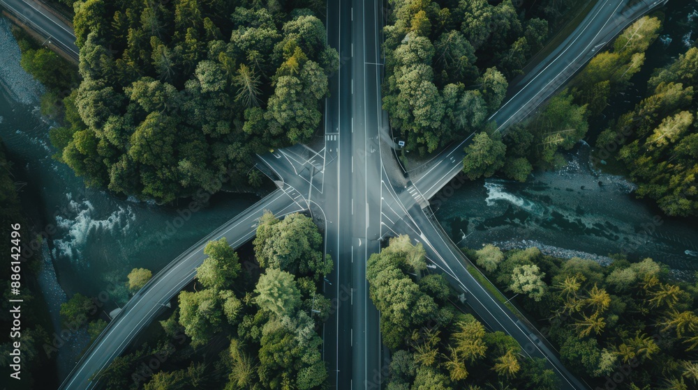 Poster capture an aerial view of a highway intersection with a river running nearby, adding a natural eleme