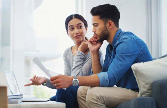 Decision, documents and laptop with couple on sofa in living room of home for bank payment. Documents, finance or thinking with man and woman in apartment to review insurance, mortgage on computer
