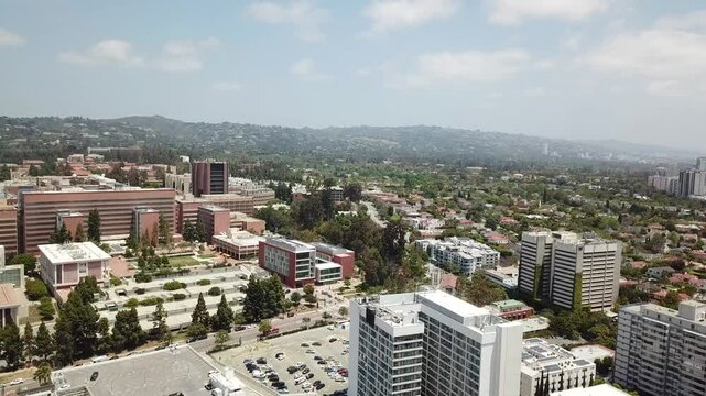 Los Angeles, California Aerial View with the Hollywood Hills and Beverly Hills in the Background on a Warm Sunny Day. Westwood and Willshire Boulevard.