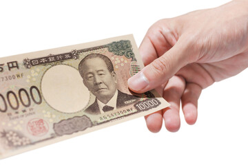日本の新紙幣。一万円札を1枚持っている手