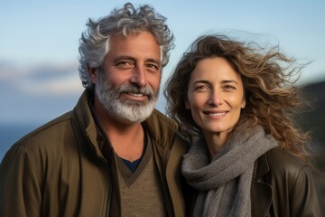 Happy senior couple enjoying active retirement in nature, embracing vitality and love together