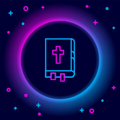 Fototapeta premium Glowing neon line Holy bible book icon isolated on black background. Colorful outline concept. Vector