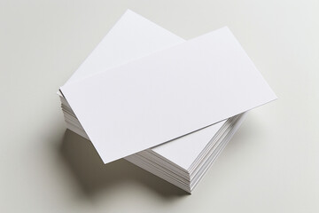 A stack of blank business cards on a plain surface, offering a clean slate for your design and branding needs.