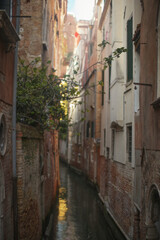 Sunlit Canal with Classic Venetian Architecture