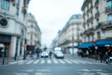 A blurry shot of a Parisian street with a crosswalk in the foreground and buildings in the background.
