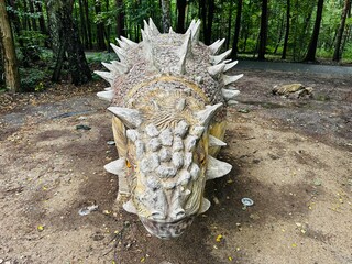 Sajchania dinosaur. Realistic figure of an Sajchania dinosaur inforest park in Kazimierz Sosnowiec. Prehistoric predator create a fascinating element of the landscape, attracting dinosaur lovers. © Chawran