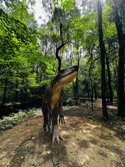 Wawel Dragon. Dragon from Lisowice.Archozaur dinosaur. Realistic figure of an Archozaur dinosaur inforest park in Kazimierz Sosnowiec. Prehistoric predator fascinating element of the landscape. © Chawran