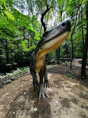 Wawel Dragon. Dragon from Lisowice.Archozaur dinosaur. Realistic figure of an Archozaur dinosaur inforest park in Kazimierz Sosnowiec. Prehistoric predator fascinating element of the landscape. © Chawran