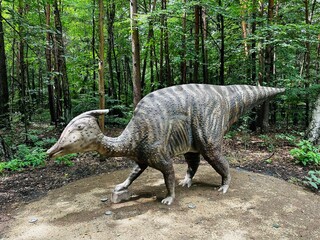 Zaurolof dinosaur. Realistic figure of an Zaurolof dinosaur inforest park in Kazimierz Sosnowiec. Prehistoric predator create a fascinating element of the landscape, attracting dinosaur lovers. © Chawran