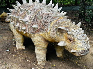 Sajchania dinosaur. Realistic figure of an Sajchania dinosaur inforest park in Kazimierz Sosnowiec....