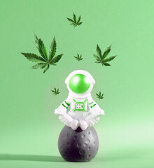 Cute little astronaut sitting on moon with cannabis leaves flying above.