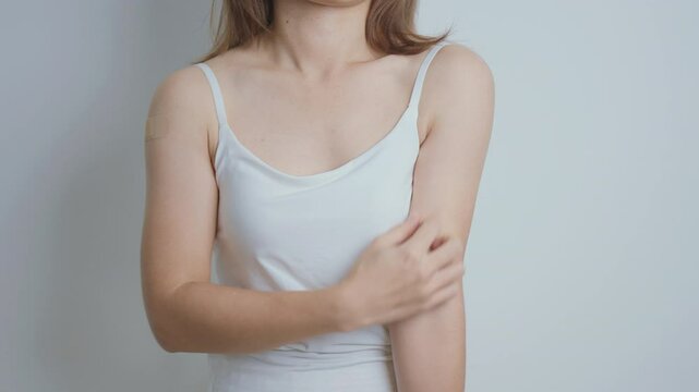 woman itching and scratching itchy arm. Sensitive Skin Allergic reaction to insect bite, food, drug dermatitis. Dermatology, Leprosy day, Systemic lupus erythematosus, Allergy symptoms and rash Eczema