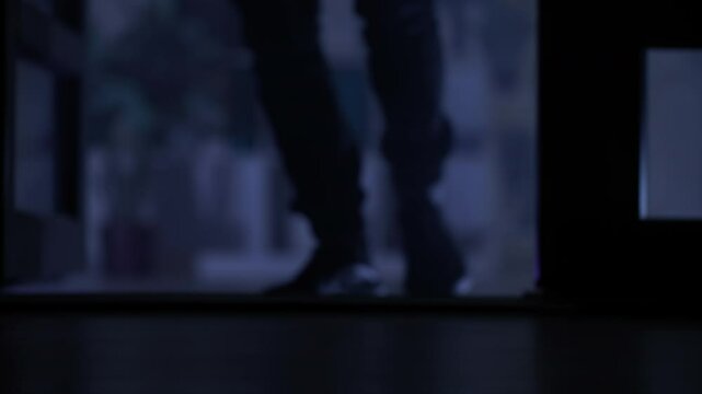 theft, man sneaks into apartment at night, legs close-up