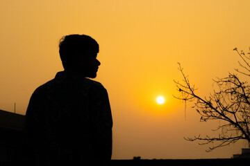 Fototapeta premium Picture of a Male Model posing outdoor. Man posing in creative lighting.