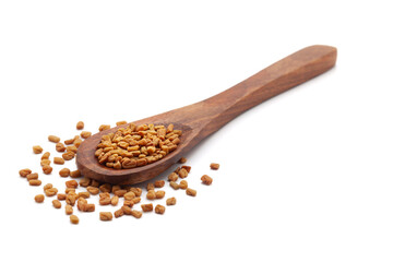Front view of a wooden spoon filled with Organic Fenugreek seeds (Trigonella foenum-graecum). Isolated on a white background.