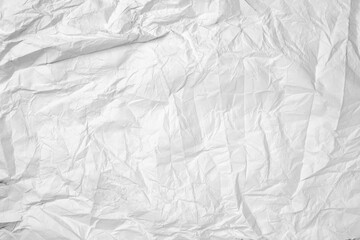 A white background with a paper that is torn and crumpled