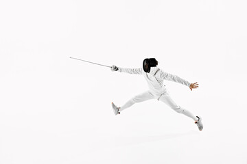 Fencer in white gear and mask with their rapier extended forward, performing dynamic jump against...