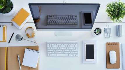 Flat Lay White Desk with Computer, Keyboard, Phone and Office Supplies.