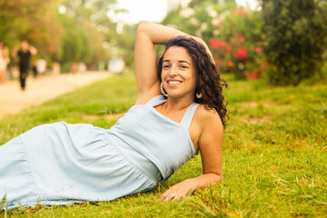 woman relaxing in the park with beautiful smile