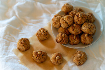 Lots of small nut cookies with whole almonds in the middle