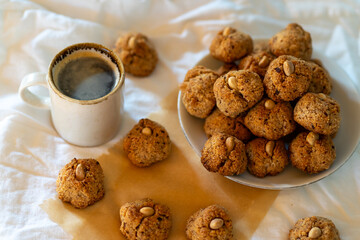 Lots of small nut cookies with whole almonds in the middle