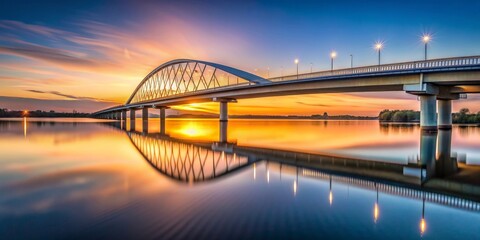 Naklejka premium Conic bridge at dusk over calm water , bridge, conic, dusk, architecture, water, reflection, tranquil, peaceful, evening