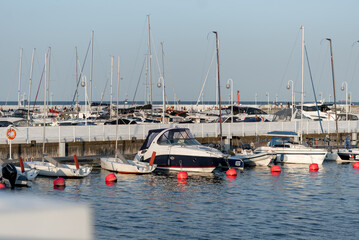 Fototapeta premium Yachts are parked at the sea pier. Travel and recreation. Pier.