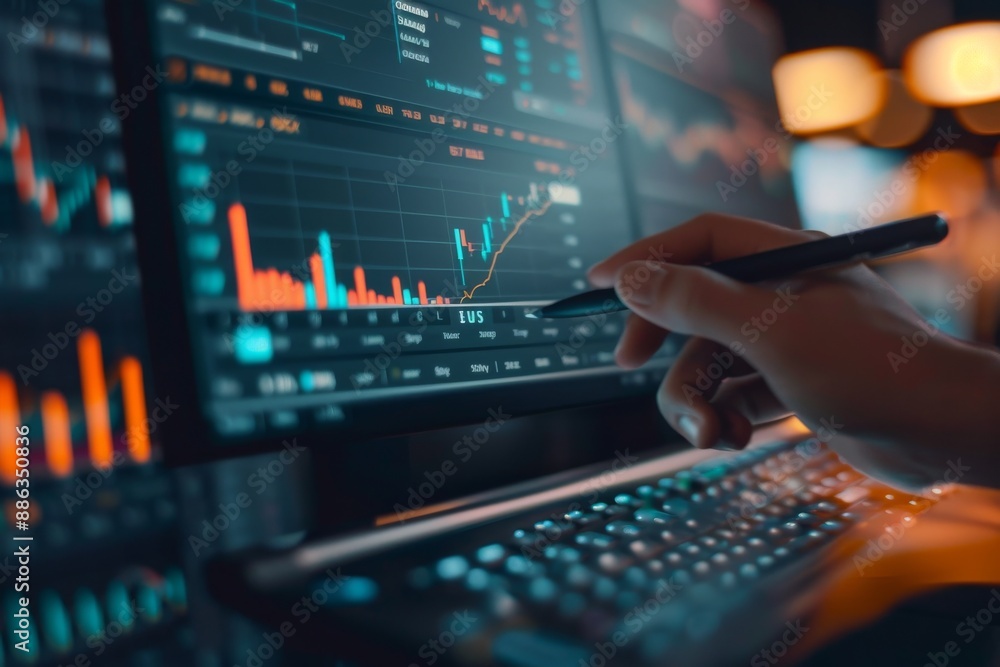 Poster a hand points at a computer screen with real-time stock market data, showing a rising trend