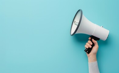 Hand Holding Megaphone on Blue Background