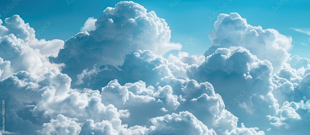 Leinwandbilder cloudscape background with a blue sky filled with white fluffy clouds ideal for a copy space image