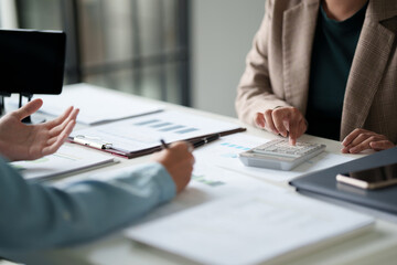 Two colleagues working analytic in office