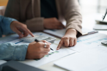 Two colleagues working analytic in office