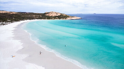 Australian surfers going to surf in beautiful turquoise water