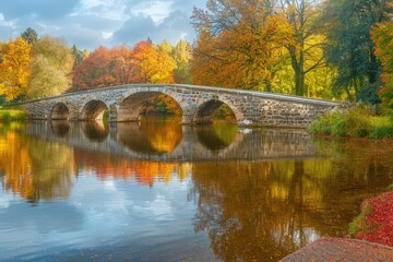 Stone Bridge Over a Tranquil Autumn Lake