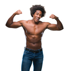 Fototapeta premium Afro american shirtless man showing nude body over isolated background showing arms muscles smiling proud. Fitness concept.